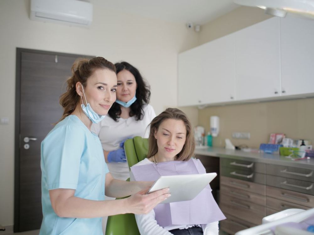 Team member reviewing treatment costs with a patient